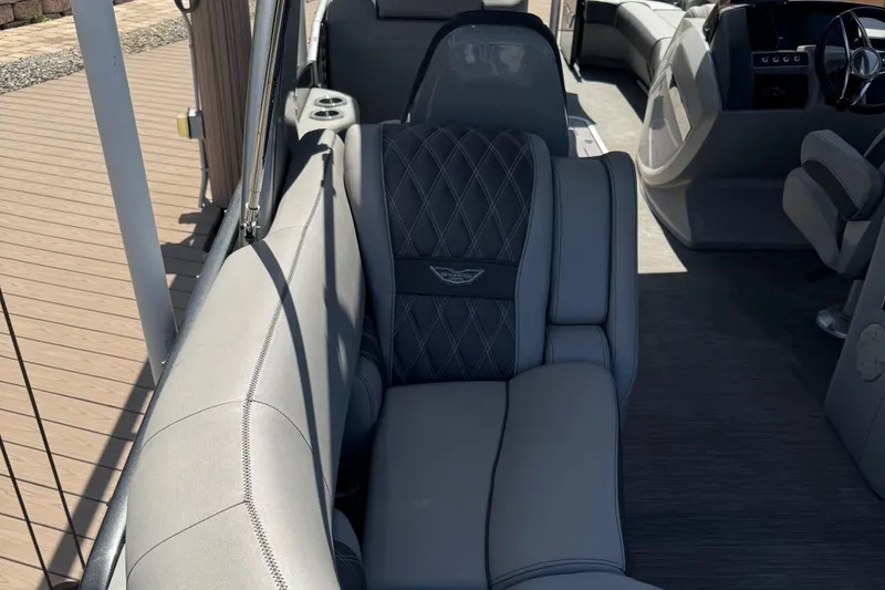 Slide: The Image of 2022 Bennington RX 25 RXFBA boat interior with luxurious gray seating and modern design. - 18