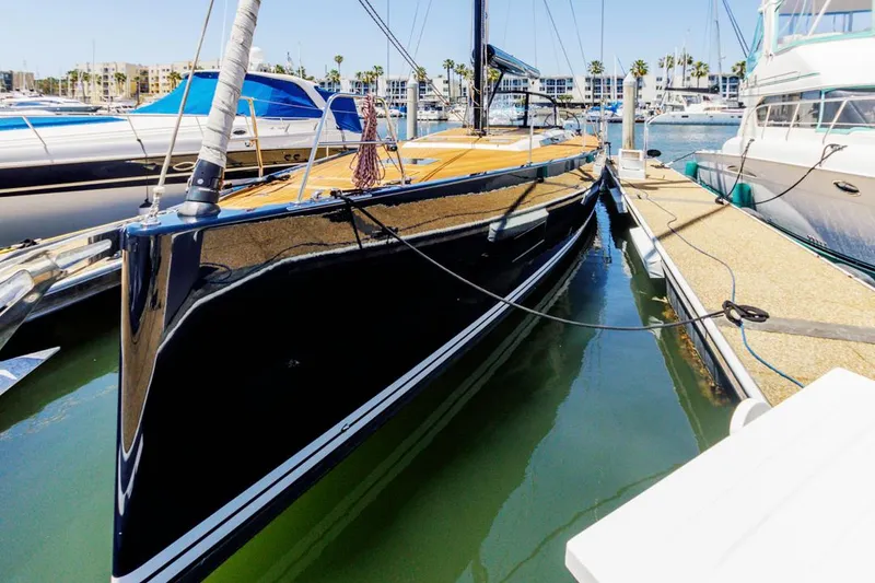 Slide: The Image of Luxurious 2017 Solaris 50 yacht docked in a marina, showcasing sleek design and elegance. - 1