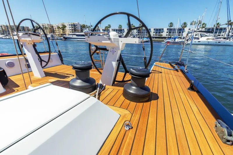 Slide: The Image of Deck of 2017 Solaris 50 yacht with steering wheels and winches, docked in marina. - 10