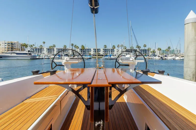 Slide: The Image of Luxurious 2017 Solaris 50 yacht with dual steering wheels, docked in a sunny marina. - 13