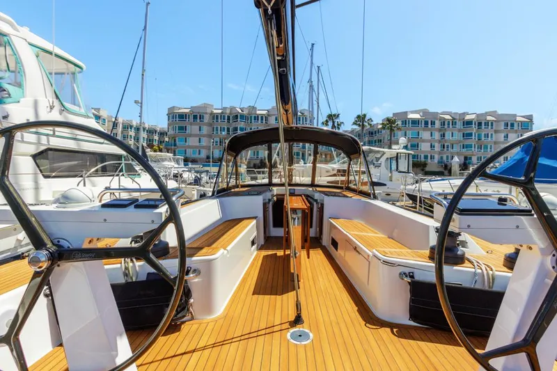 Slide: The Image of Luxurious 2017 Solaris 50 yacht with dual steering wheels docked at a marina. - 14