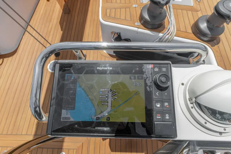 Slide: The Image of Navigation system on 2017 Solaris 50 yacht, displaying map and controls on wooden deck. - 19