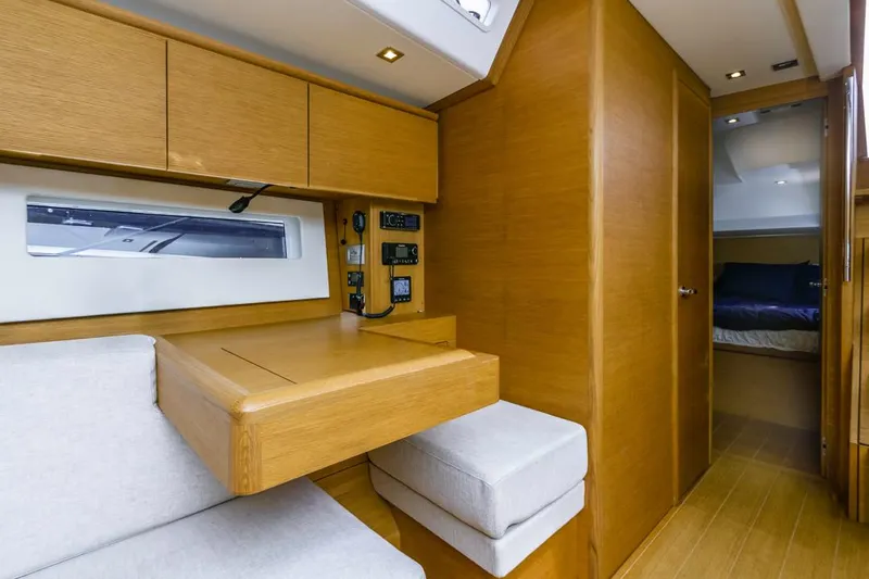 Slide: The Image of Interior of 2017 Solaris 50 yacht with wooden cabinetry and seating area. - 29