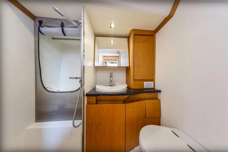 Slide: The Image of Luxurious bathroom in 2017 Solaris 50 yacht with modern fixtures and wooden cabinetry. - 38