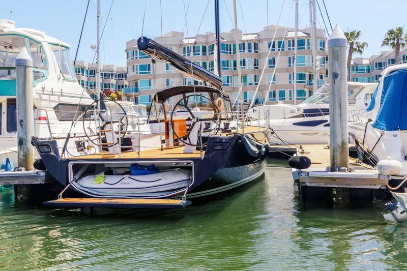 Slide: The Image of Sleek 2017 Solaris 50 yacht docked in a marina, surrounded by other boats. - 39