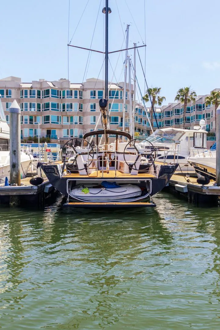 Slide: The Image of 2017 Solaris 50 yacht docked in marina with waterfront buildings in background. - 40