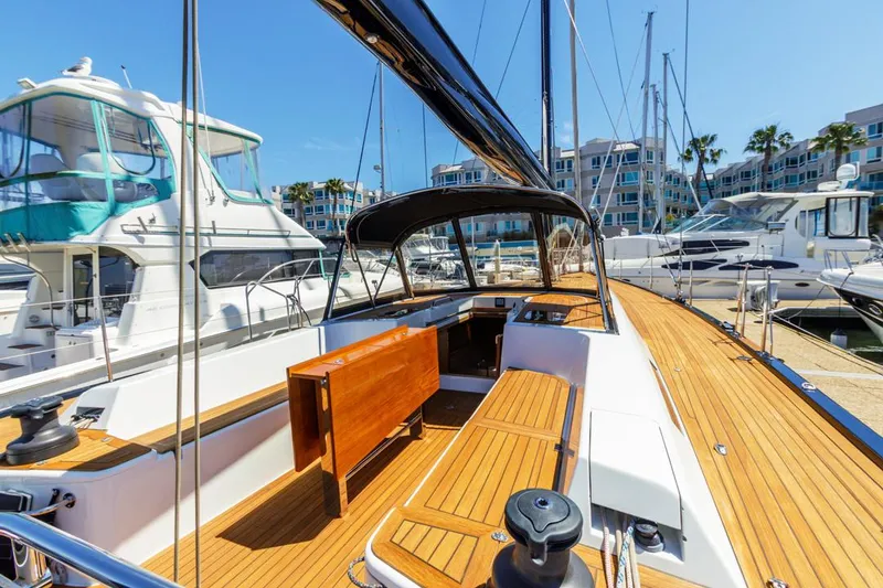 Slide: The Image of Luxurious 2017 Solaris 50 yacht with teak deck, docked in a sunny marina. - 7