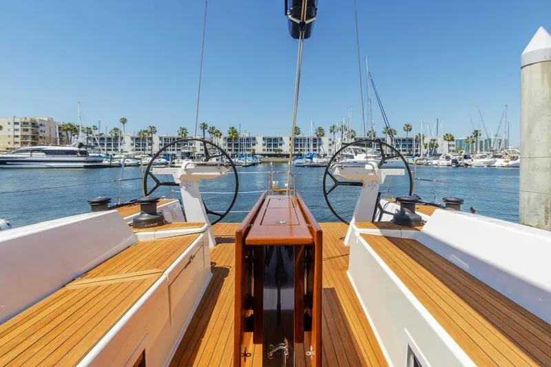 Slide: The Image of Luxurious 2017 Solaris 50 yacht with dual steering wheels in a sunny marina. - 9