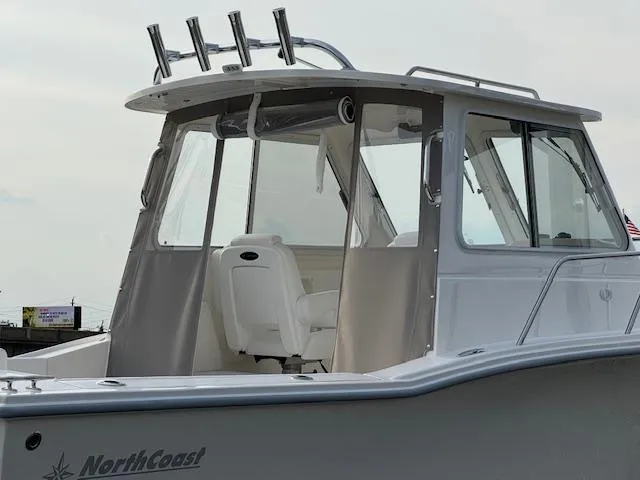 Slide: The Image of 2025 NorthCoast 235 HT boat, featuring sleek design and modern cabin. - 3