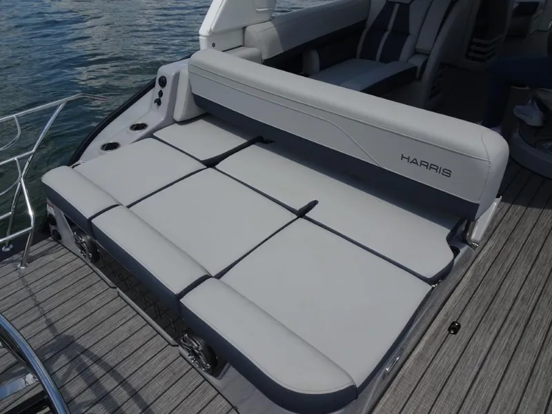 Slide: The Image of 2025 Harris Grand Mariner 250 boat with luxurious gray seating on deck. - 10