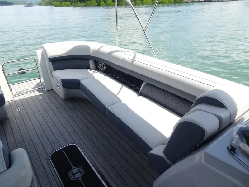 Slide: The Image of Luxurious seating on 2025 Harris Grand Mariner 250 boat, overlooking serene water. - 18