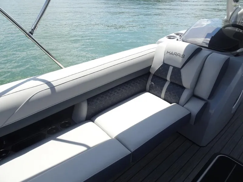 Slide: The Image of Luxurious seating on 2025 Harris Grand Mariner 250 boat, overlooking calm water. - 21