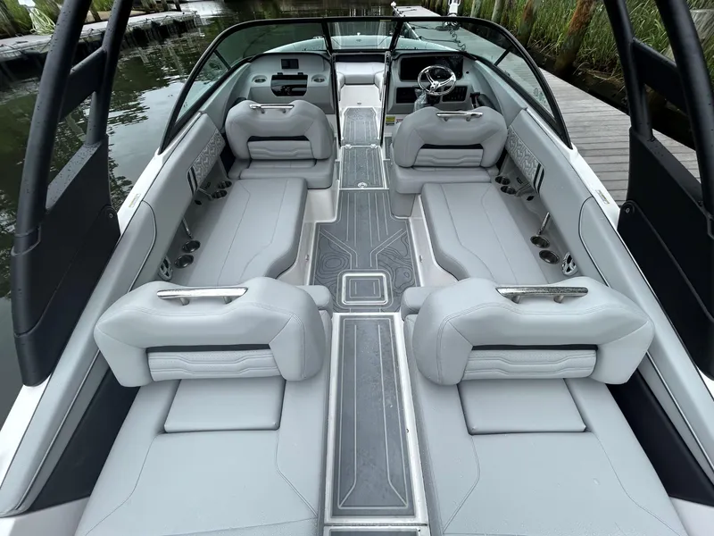 Slide: The Image of 2026 Regal LX2 boat interior with sleek gray seating and modern dashboard design. - 3