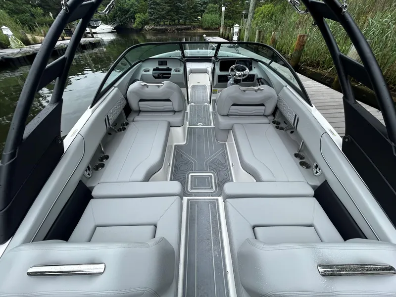 Slide: The Image of 2026 Regal LX2 boat interior with sleek gray seating and modern design. - 5