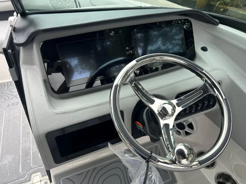 Slide: The Image of Steering wheel and dashboard of 2026 Regal LX2 boat with modern controls. - 7