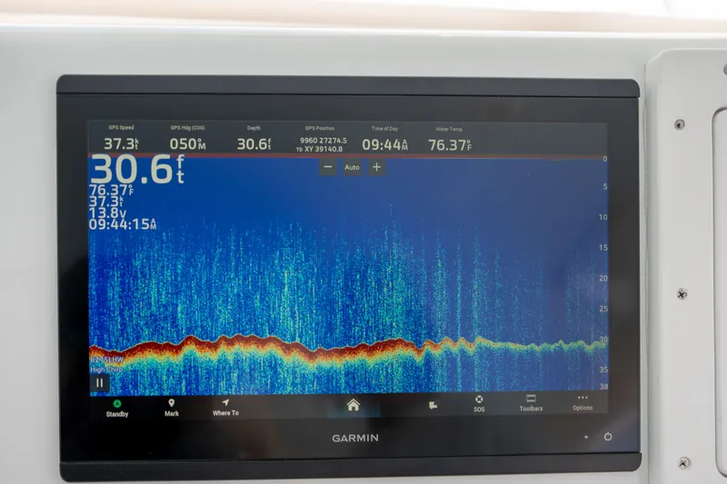 Slide: The Image of Garmin marine display showing depth and water temperature on Custom Carolina Layton Express, 2007. - 15