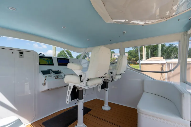 Slide: The Image of 2007 Custom Carolina Layton Express helm with dual seats, modern controls, and panoramic windows. - 16