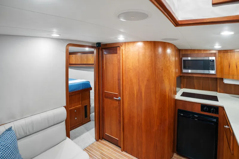 Slide: The Image of Interior of 2007 Custom Carolina Layton Express yacht with wood finish and modern amenities. - 24