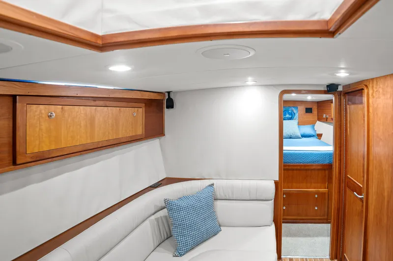 Slide: The Image of Luxurious 2007 Custom Carolina Layton Express yacht interior with cozy seating and elegant wood finishes. - 26