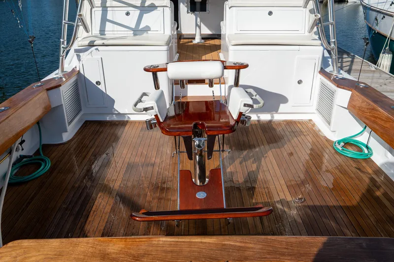 Slide: The Image of 2007 Custom Carolina Layton Express boat deck with wooden flooring and fishing chair. - 36
