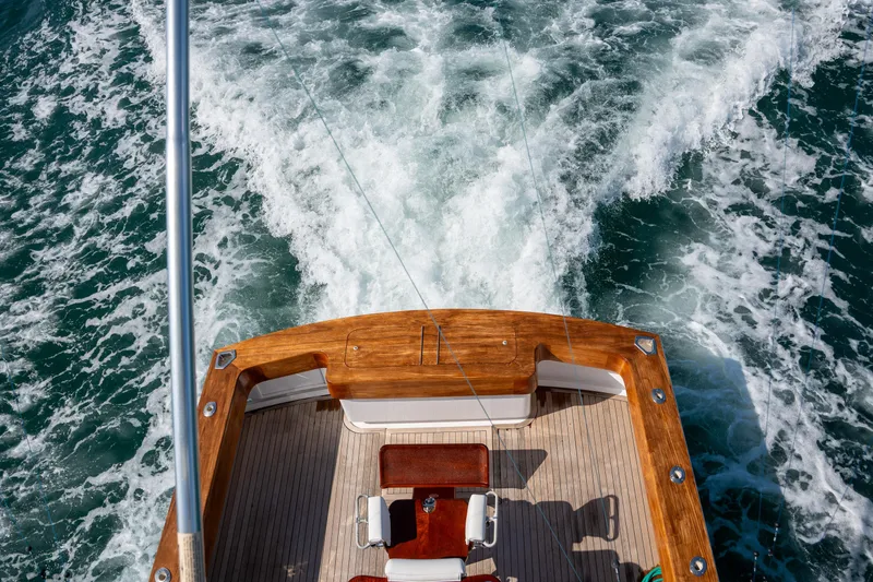 Slide: The Image of 2007 Custom Carolina Layton Express boat cruising on ocean waters, view from deck. - 39