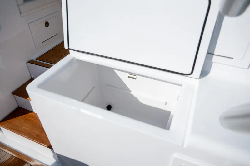 Slide: The Image of Open storage compartment on 2007 Custom Carolina Layton Express boat. - 41