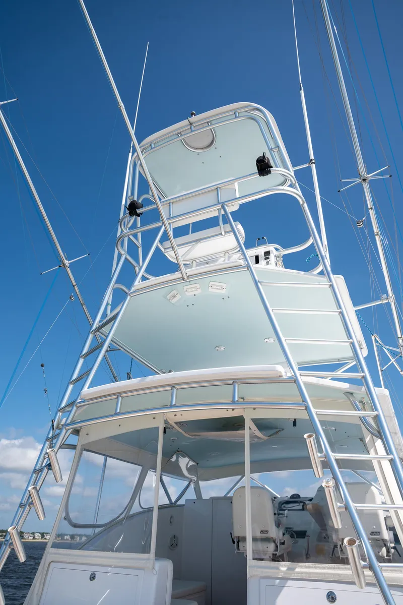 Slide: The Image of 2007 Custom Carolina Layton Express boat with tower against clear blue sky. - 48
