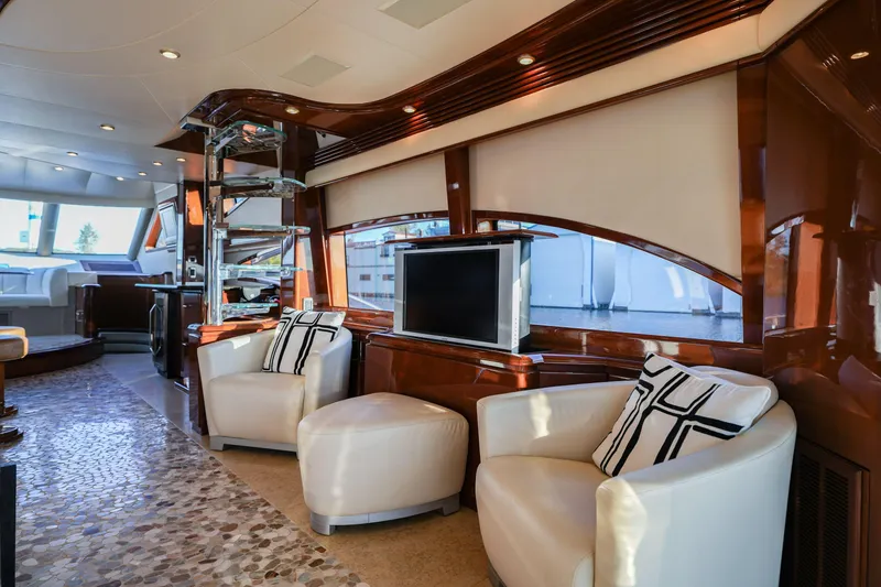 Slide: The Image of Luxurious interior of a 2006 Marquis 65 yacht with elegant seating and modern decor. - 13