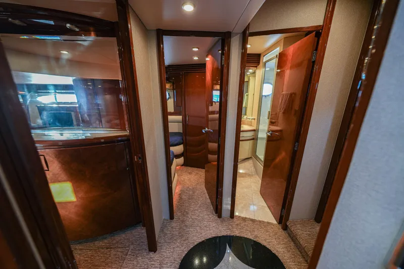 Slide: The Image of Luxurious interior of a 2006 Marquis 65 yacht, featuring elegant wood finishes and modern design. - 15