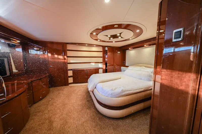 Slide: The Image of Luxurious bedroom interior of 2006 Marquis 65 yacht with elegant wood finishes and modern design. - 18