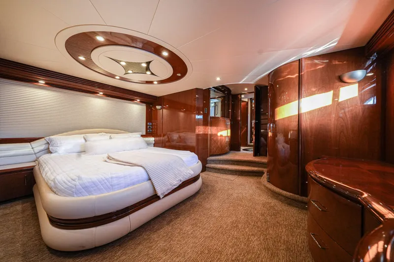 Slide: The Image of Luxurious bedroom interior of 2006 Marquis 65 yacht with elegant wood finishes and modern lighting. - 19