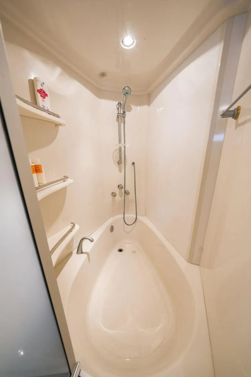 Slide: The Image of Luxurious bathroom in 2006 Marquis 65 yacht with modern shower and bathtub. - 21