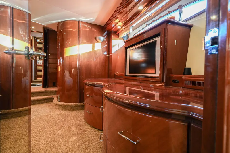 Slide: The Image of Luxurious interior of 2006 Marquis 65 yacht with polished wood and built-in TV. - 22