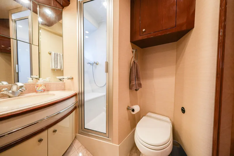 Slide: The Image of Luxurious bathroom in 2006 Marquis 65 yacht with shower, vanity, and toilet. - 26