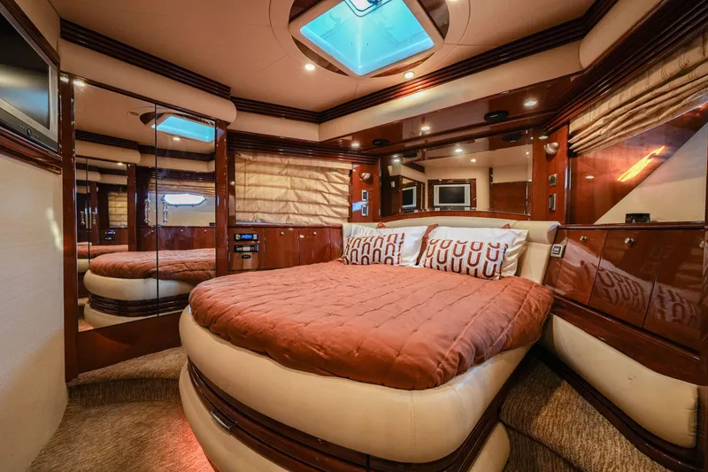 Slide: The Image of Luxurious bedroom interior of a 2006 Marquis 65 yacht with elegant wood finishes. - 27