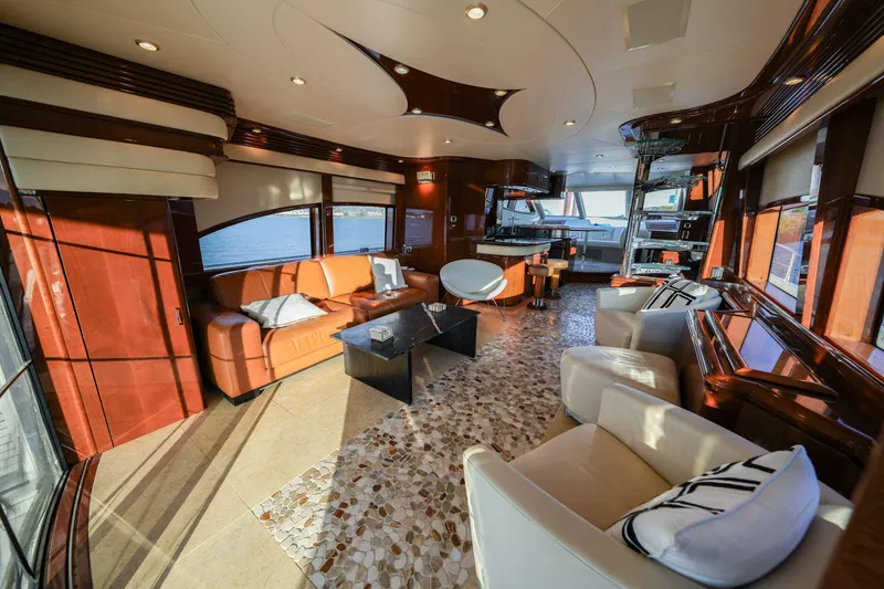 Slide: The Image of Luxurious interior of a 2006 Marquis 65 yacht with elegant seating and panoramic windows. - 7