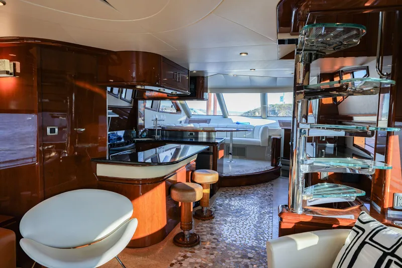 Slide: The Image of Luxurious interior of a 2006 Marquis 65 yacht with modern furnishings and elegant design. - 8