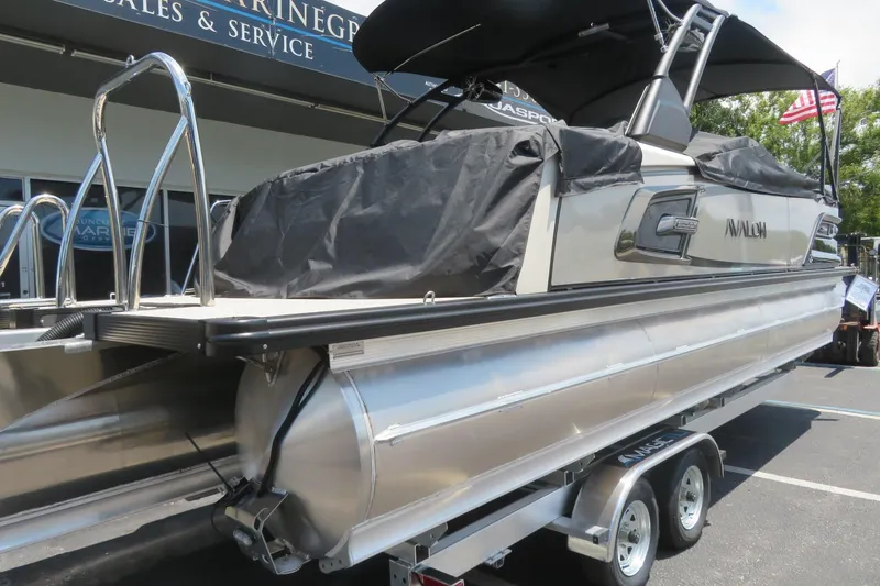 Slide: The Image of 2026 Avalon Excalibur LTD Elite Windshield, Saltwater Series branding, reflective surface. - 12