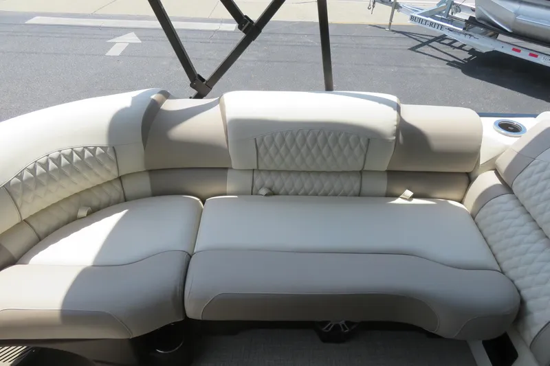 Slide: The Image of 2026 Avalon Excalibur LTD Elite Windshield boat on trailer at dealership. - 14