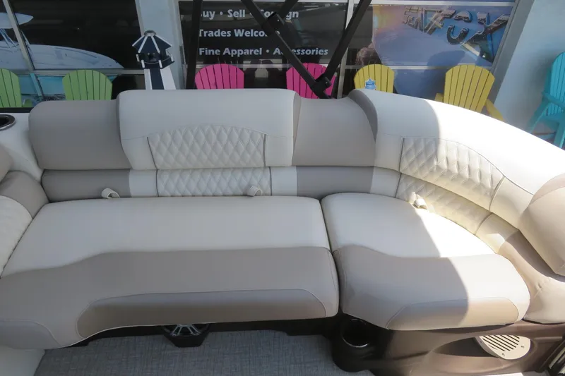 Slide: The Image of 2026 Avalon Excalibur LTD Elite Windshield pontoon boat on trailer, featuring sleek design and canopy. - 16