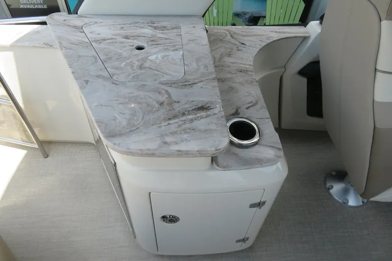 Slide: The Image of Storage compartment in 2026 Avalon Excalibur LTD Elite Windshield with a white plastic bin. - 35