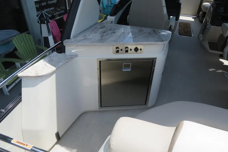 Slide: The Image of Luxurious interior of 2026 Avalon Excalibur LTD Elite Windshield boat with plush seating. - 36