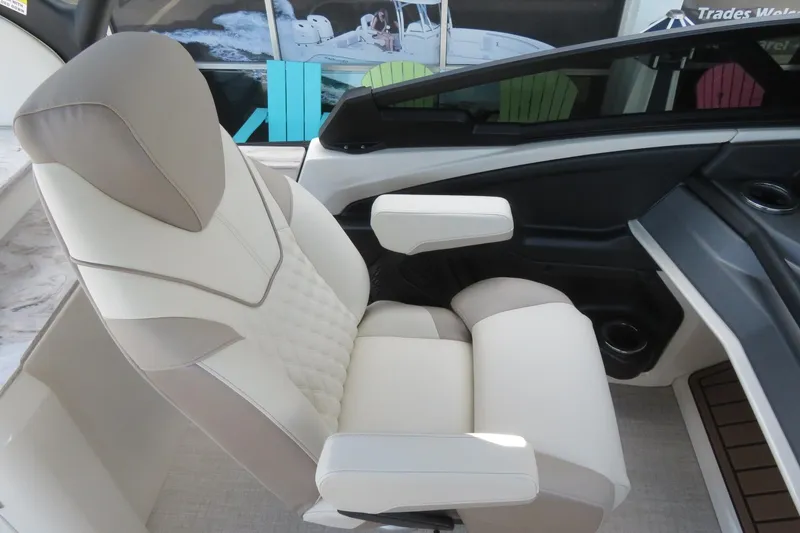 Slide: The Image of Storage compartment in Avalon Excalibur LTD Elite Windshield 2026, featuring beige leather seats. - 41