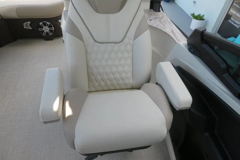 Slide: The Image of Interior of 2026 Avalon Excalibur LTD Elite Windshield boat with modern kitchenette. - 43