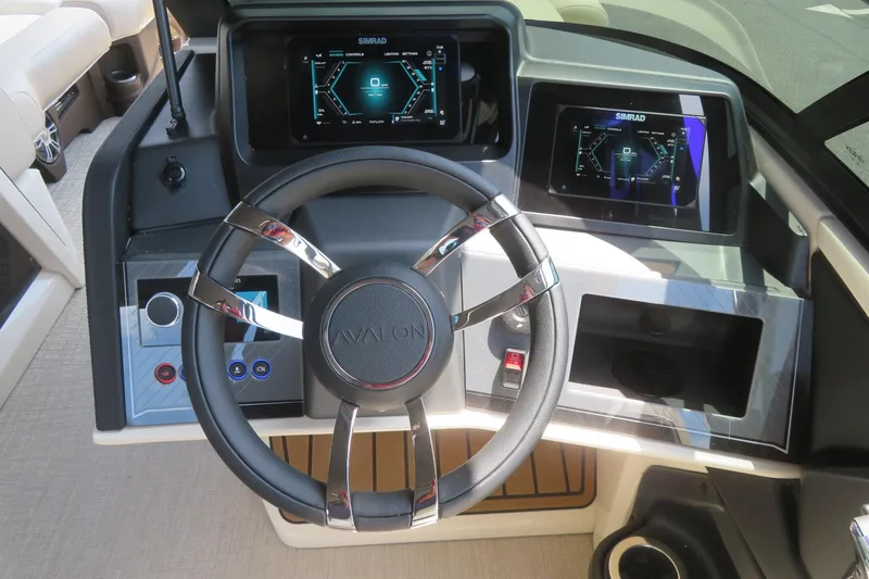 Slide: The Image of Luxurious seating in 2026 Avalon Excalibur LTD Elite Windshield boat, featuring diamond-stitched upholstery. - 53