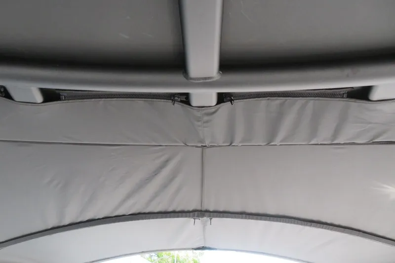 Slide: The Image of 2026 Avalon Excalibur LTD Elite Windshield storage compartment with equipment and battery setup. - 64