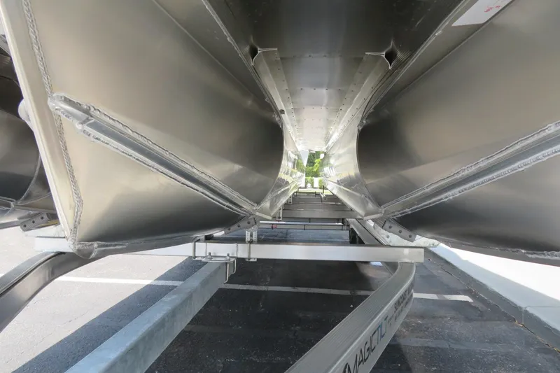 Slide: The Image of Underneath view of 2026 Avalon Excalibur LTD Elite Windshield boat on trailer. - 82