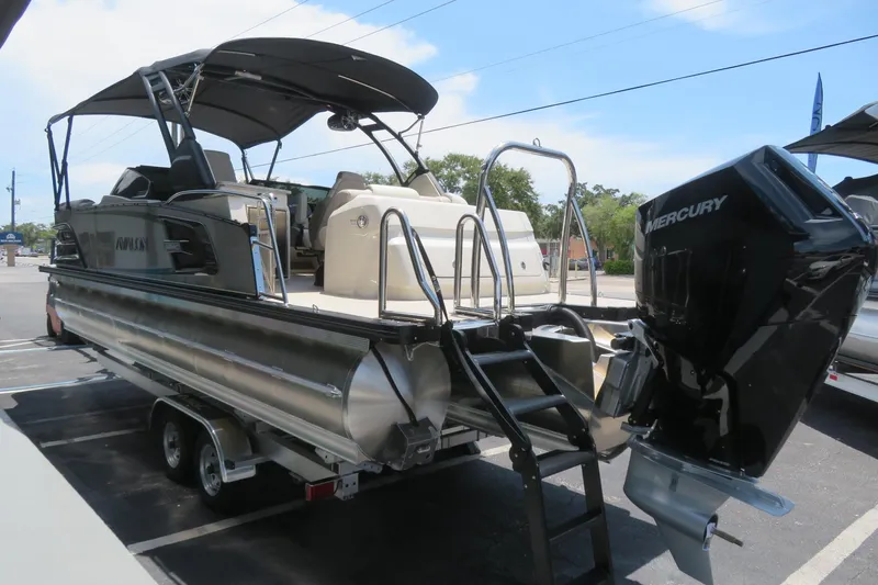 Slide: The Image of 2026 Avalon 2585 Excalibur LTD Elite Windshield luxury tri-toon boat at Sarasota dealership. - 10