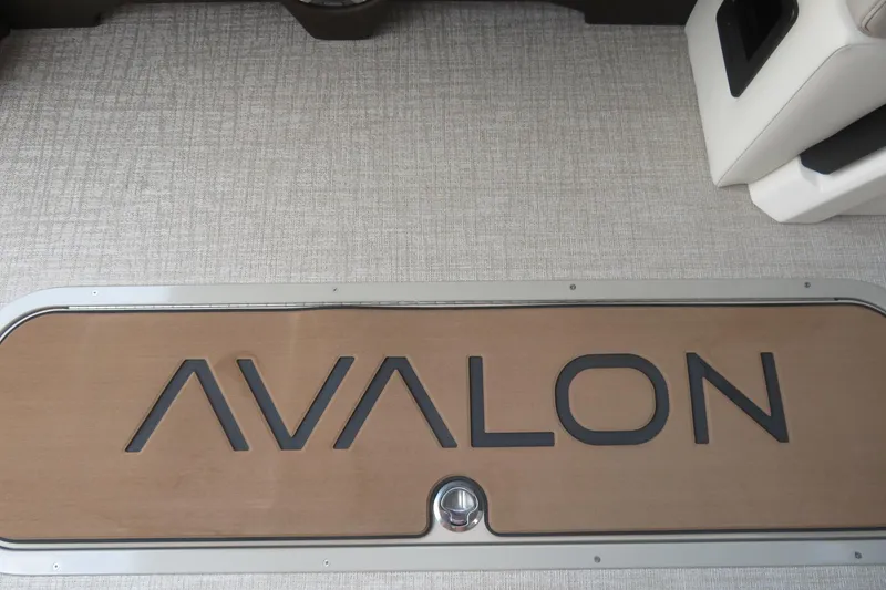 Slide: The Image of 2026 Avalon Excalibur LTD Elite Windshield, Saltwater Series branding, reflective surface. - 18