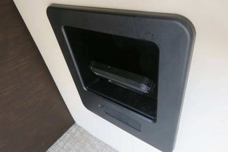 Slide: The Image of 2026 Avalon Excalibur LTD Elite Windshield boat displayed at a dealership. - 21